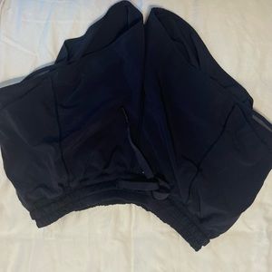 Navy Lululemon Hotty Hot shorts with drawstring ties